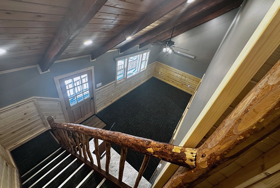Modern campground bathroom vanity featuring custom wood cabinetry with marble countertop and framed mirror, showcasing True North Construction's quality craftsmanship for Sky Ranch Campground facilities